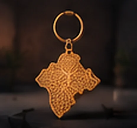 Porte-clés doré en forme de carte du Maroc